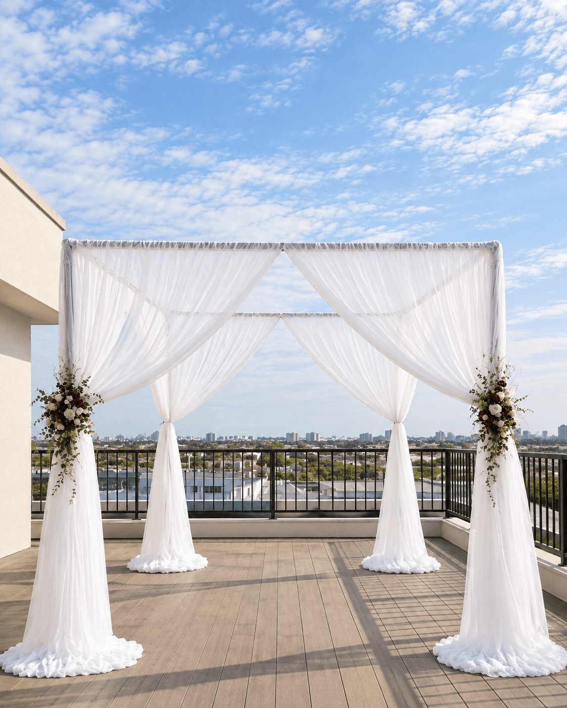 Canopy chuppah with flowing chiffon draping over a ceremony space