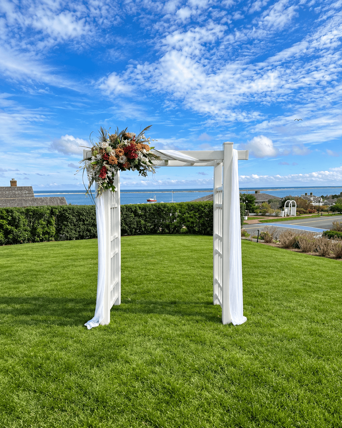 Traditional white vinyl wedding arch with a clean elegant silhouette